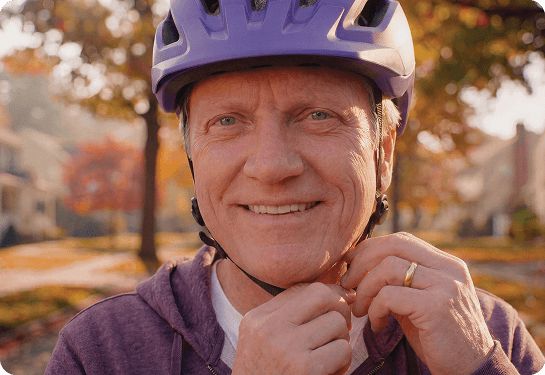 Man in a bike helmet.